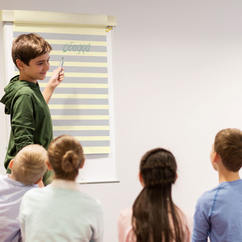 RMHFC Child using Flip Chart with friends