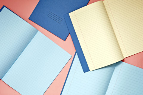 Exercise Books SEN Yellow Blue Tinted Open Overhead Lifestyle HR - Rhino Stationery