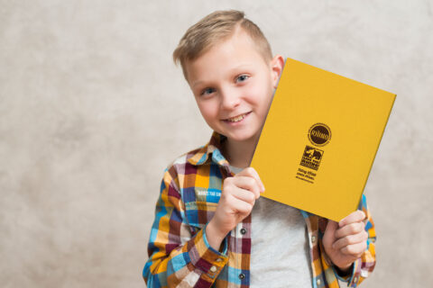 Boy presenting RHINO back - Rhino Stationery